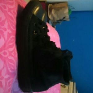 Black on black Converse All Star.