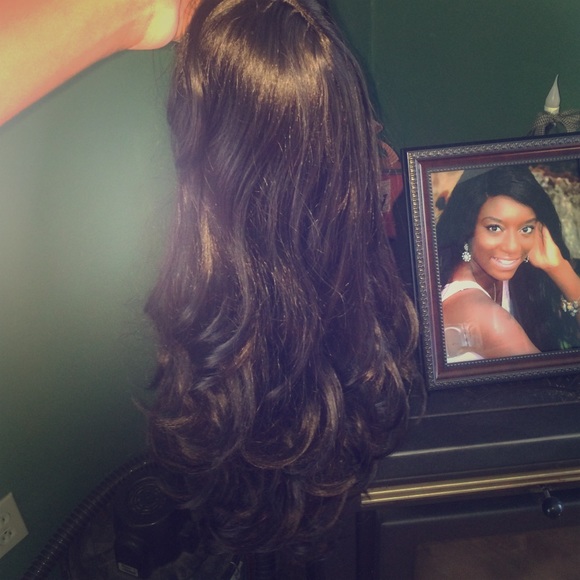 Lace front wig, long layered with bangs.