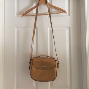 Kelly & Katie tan purse.