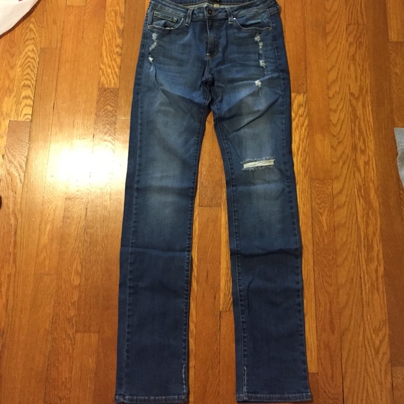 Medium wash jeans, with rip in the knee