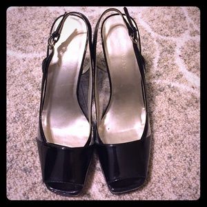 Women's Nine West black peep toe heels.