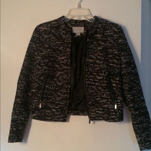 Dark blazer with white, gray, and black pattern