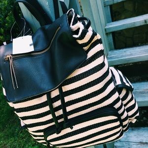 Striped leather accent backpack