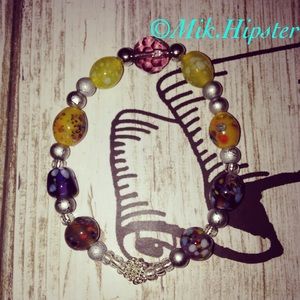 Handmade retro multi-pattern stretch bracelet.