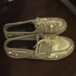 Silver sperry's!  Size 8