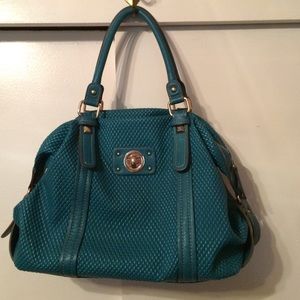 Very nice turquoise handbag.