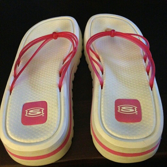 White and pink skecher sandals