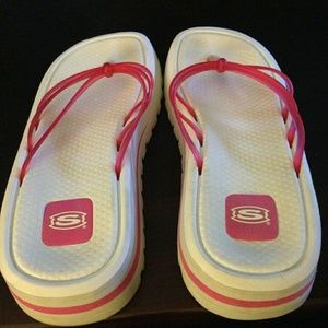 White and pink skecher sandals