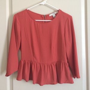 Zip-back peplum top
