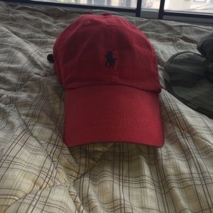 Slightly faded red leather strap polo hat