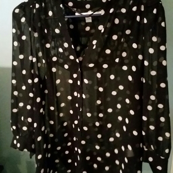 Sheer black and cream polka dot button up top.