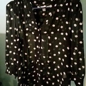 Sheer black and cream polka dot button up top.