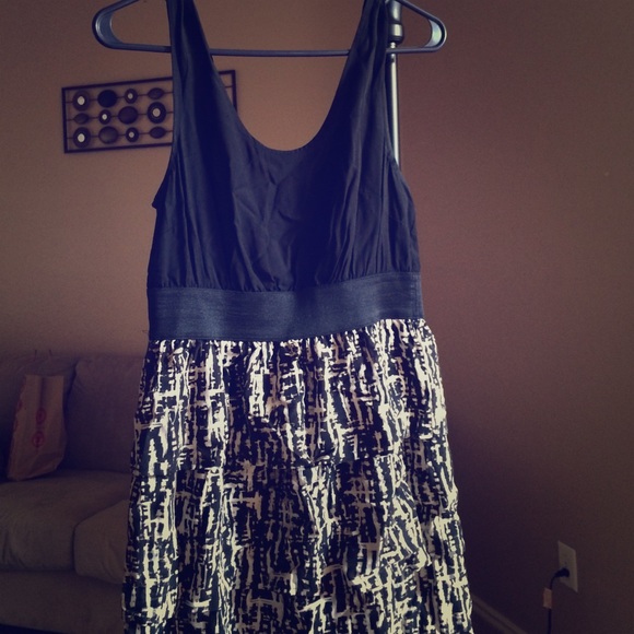 Sleeveless black dress with graffiti print skirt
