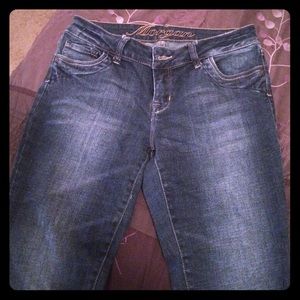 Dark relaxed fit pair of denim jeans