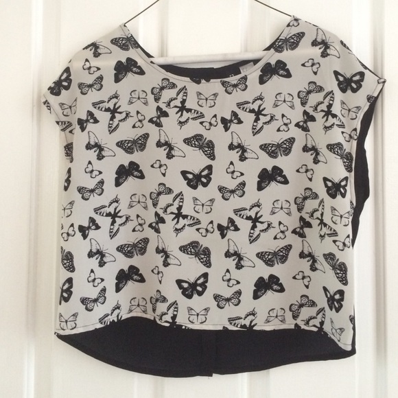 A black and white, butterfly, high low shirt