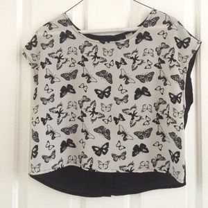 A black and white, butterfly, high low shirt