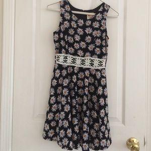 a flowy black and white daisy dress with lace