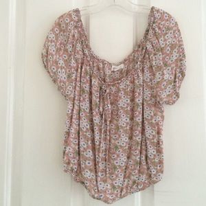 A very cute pink synched crop top with flowers