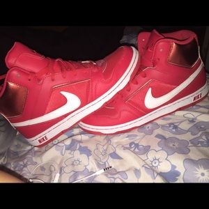 Reddish pink Nikes
