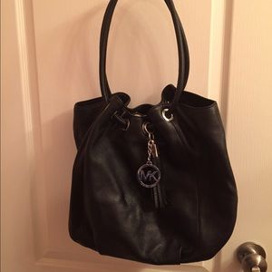 Black leather Michael Kors bag with cinch top