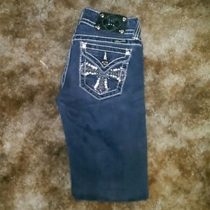 A darker color of skinny miss me jeans