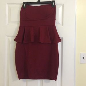 A burgundy strapless dress