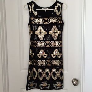 Black and gold sequin dress
