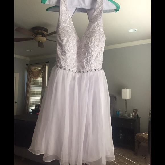 Wedding gown, short, and backless. Only wore once.