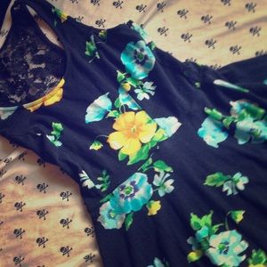 A blue dress with blue flowers and lace