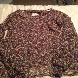 Sheer shirt with bow tie cut outs on the back