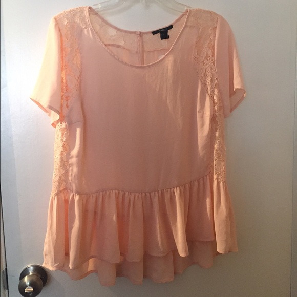 Peplum top with lace detail.