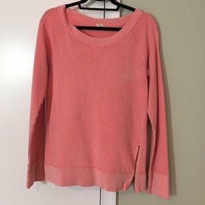 Distressed, faded light coral crew neck sweatshirt