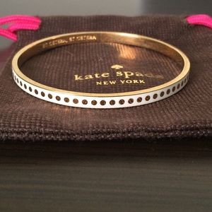 Kate Spade white bangle with gold polka dots