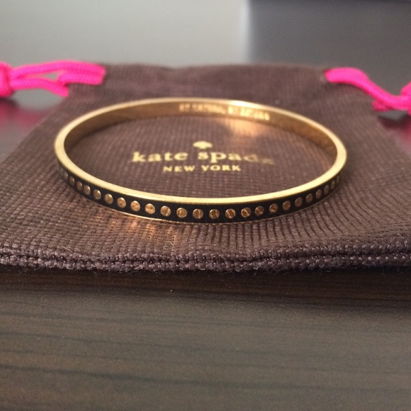 Black Kate Spade bangle with gold dots