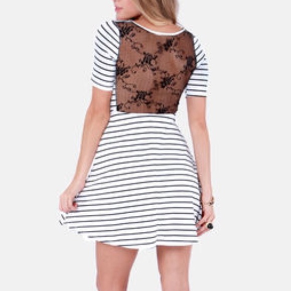 White dress with black stripes and lace detail