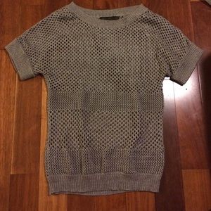 short sleeved grayish sweater