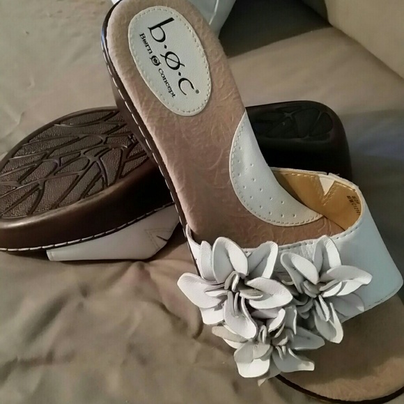 White leather shoes with beautiful leather bows.