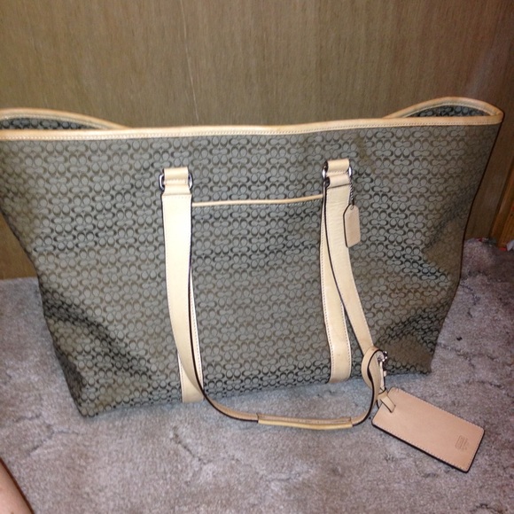 Travel size Brown with leather handles.