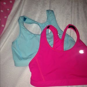 2 sports bras, one light blue one hot pink.