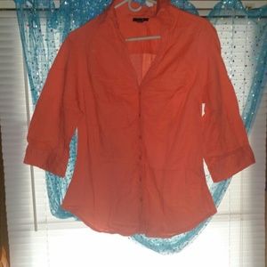 Women's orange button down mid sleeve shirt.