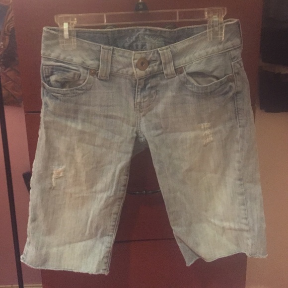 Guess - Lightly distressed over knee denim shorts