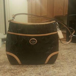 Coach shiny black purse bag with tan trimming