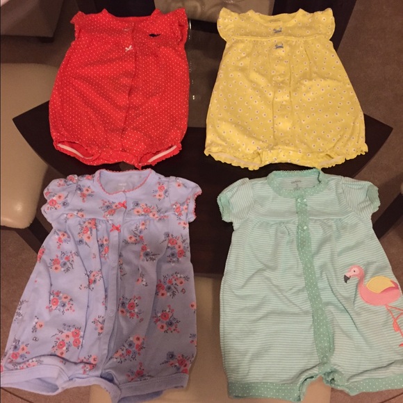 Lot of 4 baby Carters girl rompers.