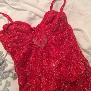 Victoria Secret body suit nighty in red lace.