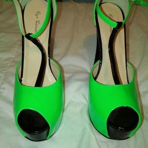 Beautiful neon green and black platform heels.