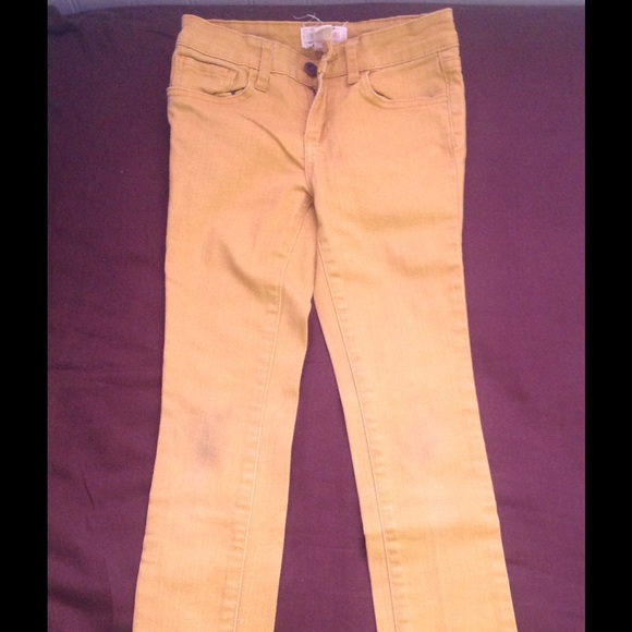 Forever 21 Girls mustard color skinny jeans.