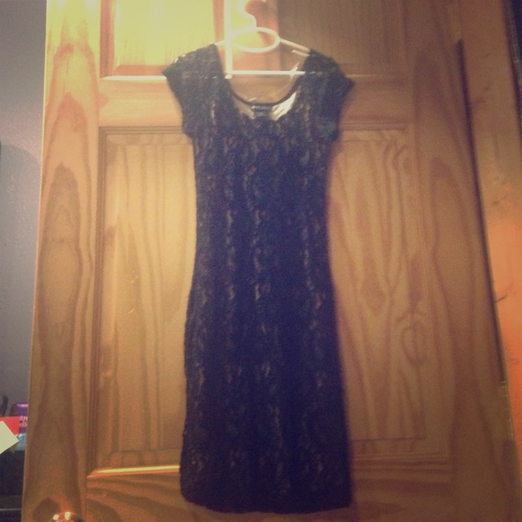 Dress with a nude color fabric under black lac