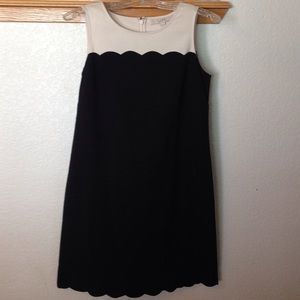 A cream and black dress