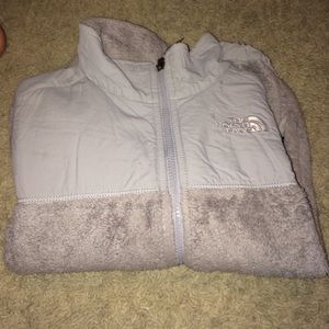Grey fuzzy north face jacket