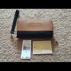 Michael Kors Multifunction Leather Clutch